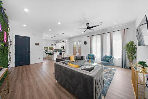 a living room with a couch and a table at Luxury Home Near Med Center, Uptown & Downtown in Houston
