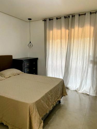 Ένα ή περισσότερα κρεβάτια σε δωμάτιο στο Suíte Lençóis