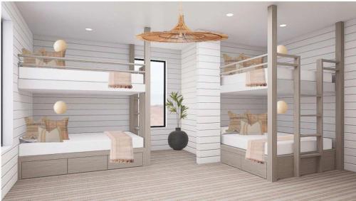 a bedroom with two bunk beds and a ceiling at The Oasis Utah at Desert Color (by Ember Stays) in St. George