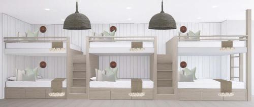 a room with two bunk beds with pillows at The Oasis Utah at Desert Color (by Ember Stays) in St. George