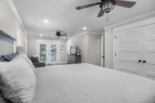 a bedroom with a bed and a ceiling fan at Nordin's LakeHouse, Lakefront Hideaway on Delaware Bay Sleeps 10 in Dardanelle