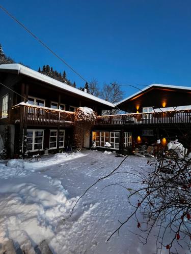 a house with snow on the ground in front of it at Fairy tale house during Ski world cup in Melhus