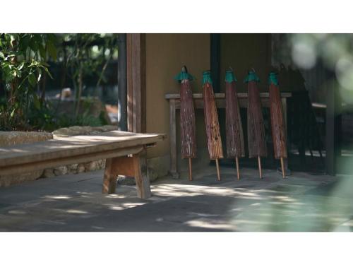 a row of surfboards lined up next to a bench at Ryokan Akebono - Vacation STAY 91900v in Saga