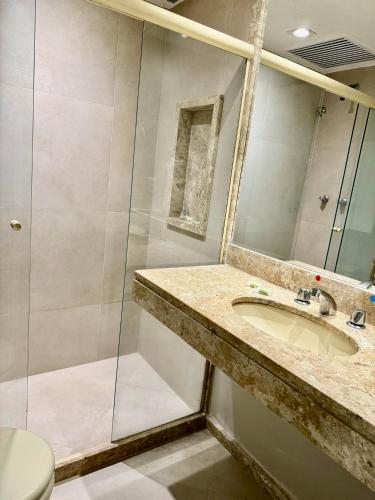 a bathroom with a sink and a shower at Hotel Casablanca Imperial in Petrópolis