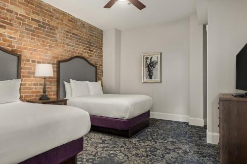 En eller flere senge i et værelse på Club Wyndham La Belle Maison