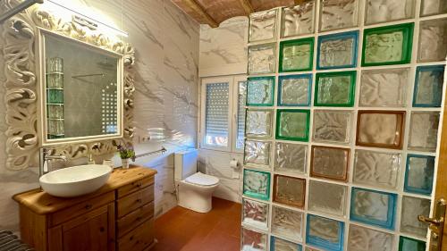 a bathroom with a sink and a toilet at Finca El Rosario in Casas de los Pinos