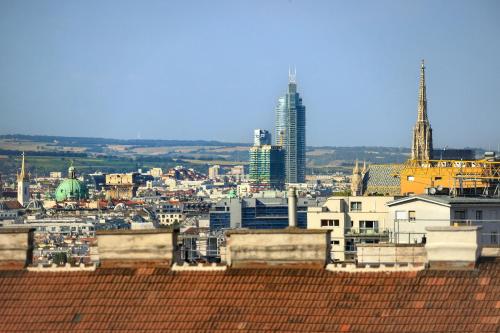 a view of a city with buildings in the background at Jimmy's Apartments Dandelion in Vienna