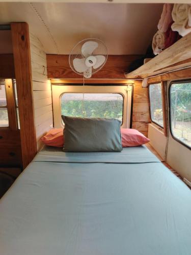 a bed in the back of an rv at El Remanso in Santa Fe