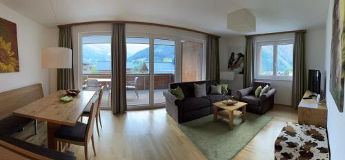 a living room with a couch and a table at Venediger-Chalet in Matrei in Osttirol