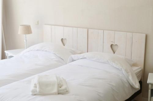 En eller flere senge i et værelse på Studio Broeckestraat 12