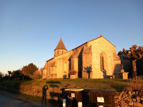 an old church sitting on the side of a road at Via Lactéa in Saint-Goussaud