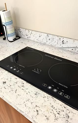 a stove top oven sitting on top of a kitchen counter at Condominios Evamar San Carlos in San Carlos