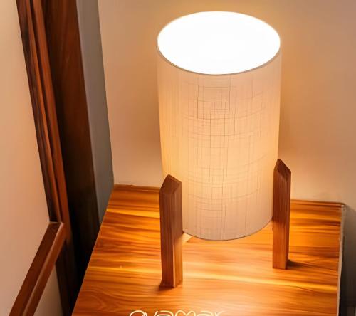 a lamp on a wooden floor in a room at Condominios Evamar San Carlos in San Carlos