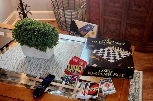 a glass table with a game set on it at Charming Cute Convenient 2 mi to Downtown and UGA in Athens