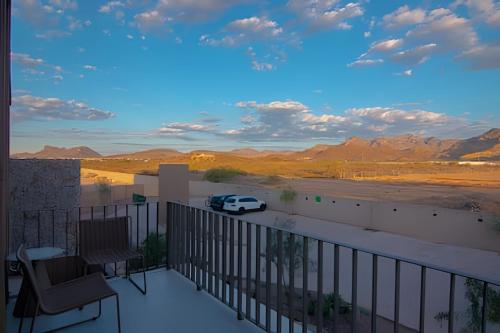 a car parked on a balcony with a view of the desert at Condominios Evamar San Carlos in San Carlos