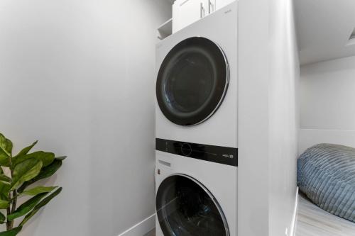 a laundry room with a washer and dryer at Desert Sands l Private Spa l Sleeps Twelve in Hurricane