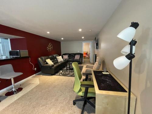 a living room with a couch and a table at Welcome to Shibly's Retreat in Edmonton