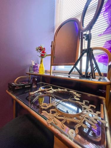 a counter top with a mirror and a sink at Siren's Cozy Cove Hideaway Mins from Downtown in Philadelphia