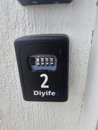 a button on a wall with the number two divide at Ferienwohnung Melissa in Unter Feuchten