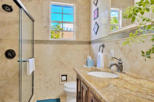 a bathroom with a sink and a shower at 5BR Villa with Heated Pool & BBQ - SoHo, Downtown Tampa and Airport in Tampa