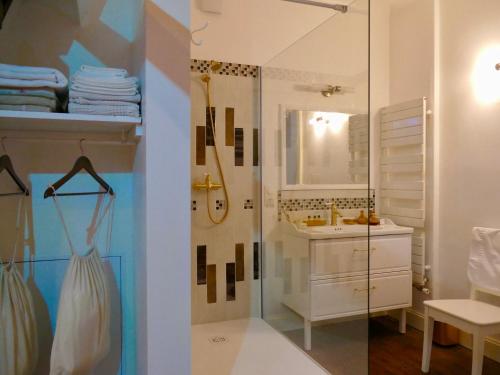 a bathroom with a shower and a sink at Villa Arcadia in Chauny