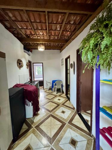 a room with a tiled floor and a ceiling at Casa Boa Vida GuestHouse in Itacaré