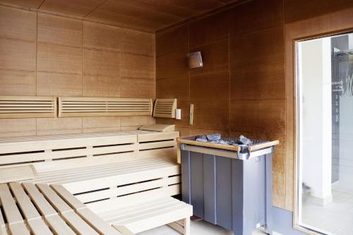 a sauna with wooden benches and a window at Hotel Schloss Montabaur in Montabaur