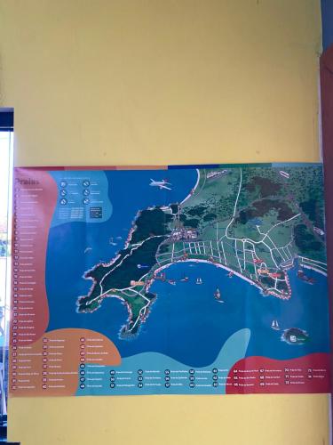 a map of japan hanging on a wall at Mar&Brisa Hospedagem in Penha