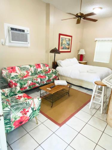 a living room with a couch and a bed at Studio-Bay access-Pet friendly in Gulf Shores