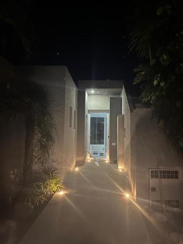 a hallway of a building at night with lights at PlayAkemi - Cojimies - Ecuador in Cojimíes