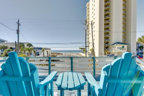 a table and chairs on a balcony with a view of the ocean at PCB Apt with Balcony and Gulf Views Walk to Beach in Panama City Beach