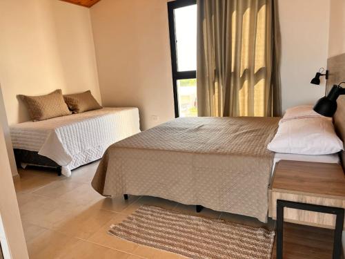 Postel nebo postele na pokoji v ubytování Apart Ogaraity Hotel