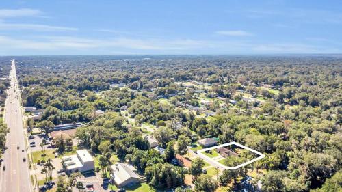 an aerial view of a town with trees and a road at Cozy Villa with Spacious Outdoor Space in Orange City