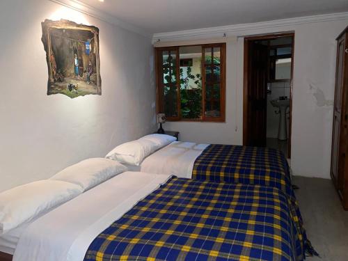 Postel nebo postele na pokoji v ubytování Posada Todos Santos