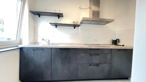 Η κουζίνα ή μικρή κουζίνα στο Home Apartments two