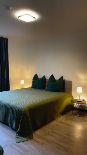Ένα ή περισσότερα κρεβάτια σε δωμάτιο στο Home Apartments two
