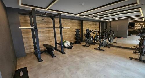 a gym with a bunch of equipment in a room at Basq Propiedades - Barrio Republica 7 in Santiago