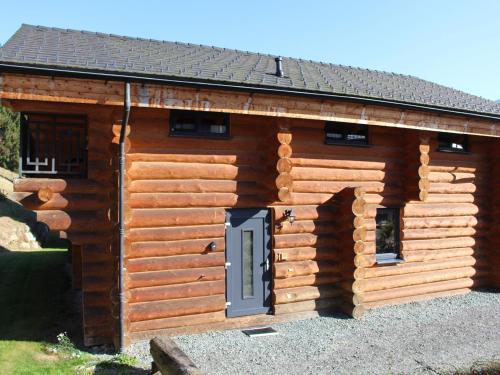 a log cabin with a door on it at Jenig 4A in Jenig