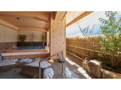 a house with a plunge pool and a fence at Gero Onsen Ogawaya - Vacation STAY 83607v in Gero