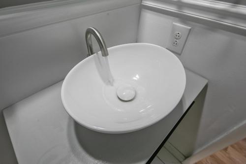 a white sink in a bathroom with a sink at Ellis Hideaway in Fayetteville