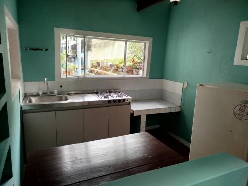 Köök või kööginurk majutusasutuses Hostal mil colores