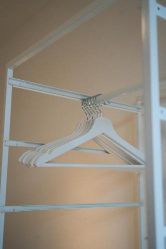 a white shelf in a closet at Duplex Apartment Bülach Station in Bülach