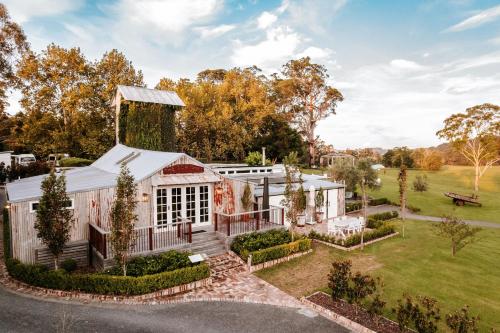 an aerial view of a barn with a garden at The Homestead in Berry