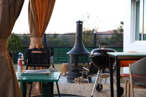 a patio with a grill and a stove at Yeoncheon Pension Nolmung dogs allowed in Yeoncheon
