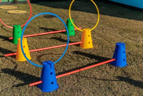 a playground with blue and yellow hoops and cones at Yeoncheon Pension Nolmung dogs allowed in Yeoncheon