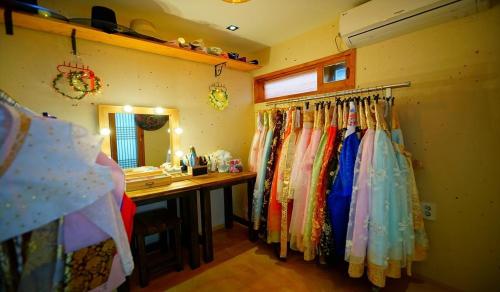 a dressing room with a vanity and a desk and a mirror at Haneulae Jeonju Hanok Village Accommodation in Jeonju