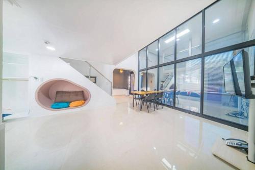 a living room with a couch and a dining room at Gapyeong Pool Villa Mountain High in Homyŏng-ni