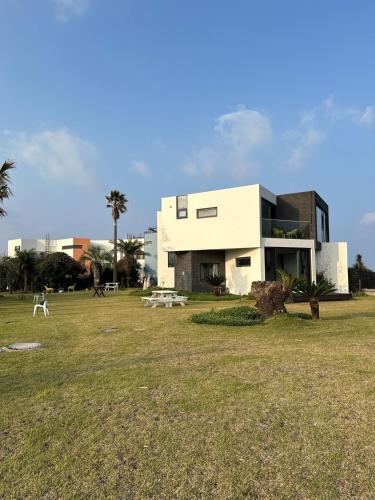 a house in a field with a large yard at Hello Gimnyeong in Jeju