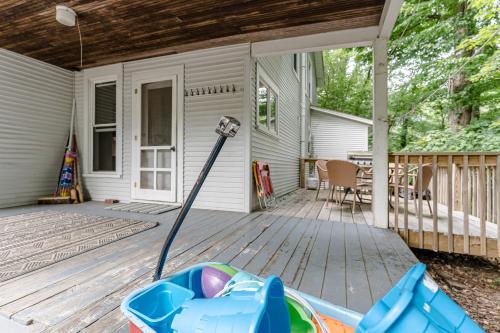 a mop on a porch of a house at Pavillion Paradise is Walking Distance to Lake Michigan in Holland