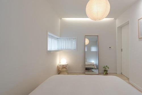 Ένα ή περισσότερα κρεβάτια σε δωμάτιο στο Hug Jeju